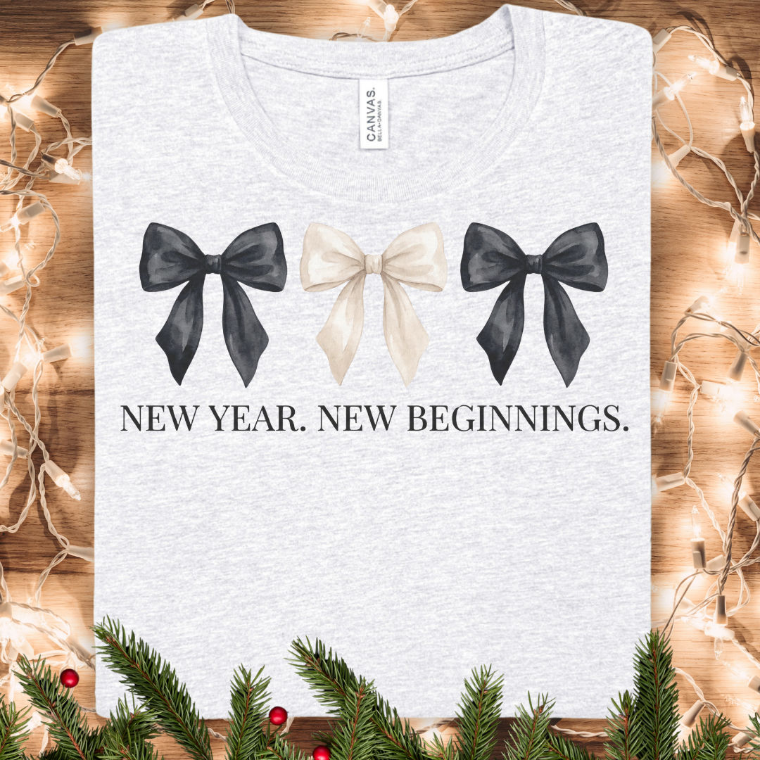 New Year, New Beginnings Tee — Ribbon Bow Graphic T‑Shirt