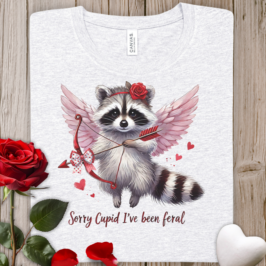 Cupid Raccoon Tee — "Sorry Cupid I've Been Feral" Cute Valentine Shirt