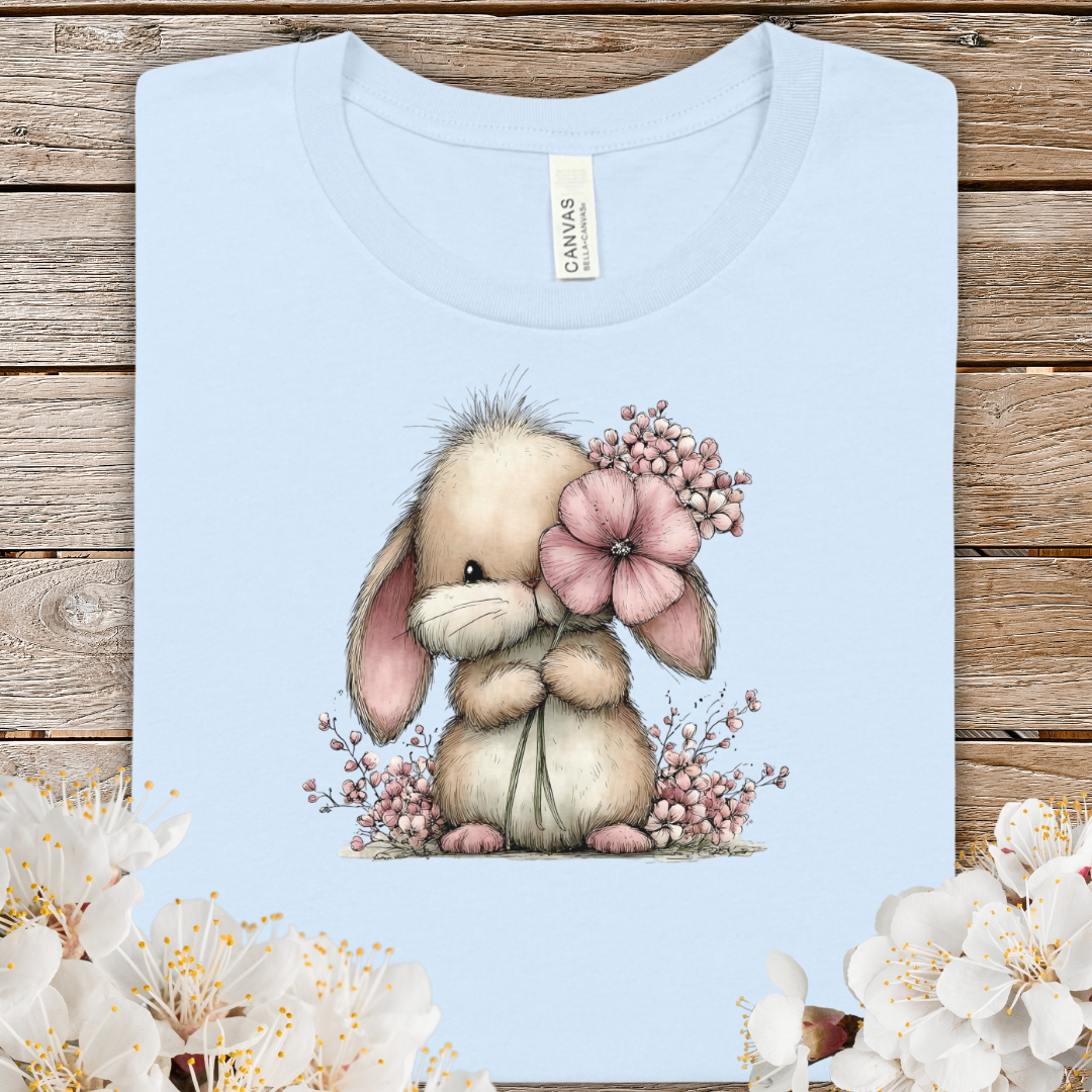 Cute Spring Bunny Holding Flower T‑Shirt — Adorable Floral Bunny Tee for Kids & Adults