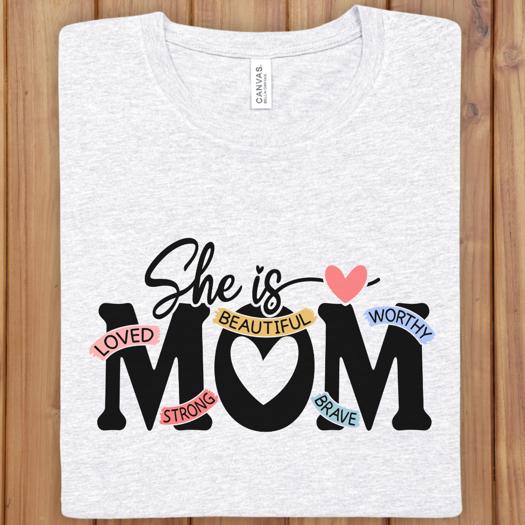 She Is Mom T‑Shirt — "She is MOM" Heart Design with Positive Words | Mother’s Day Gift